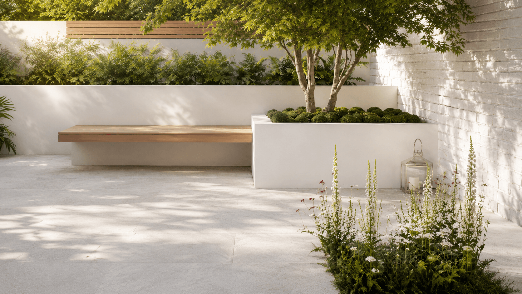 Landscaped garden patio finished with light exterior porcelain tiles